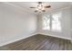 Bedroom with laminate floors, ceiling fan and windows at 5329 E Harmony Ave, Mesa, AZ 85206