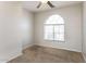 Bright bedroom with neutral carpet and a large arched window at 5329 E Harmony Ave, Mesa, AZ 85206
