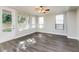 Comfortable living room featuring hardwood floors and natural light from the windows at 5329 E Harmony Ave, Mesa, AZ 85206