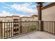 Balcony with wrought iron railing and view of a residential building at 5450 E Deer Valley Dr # 4199, Phoenix, AZ 85054