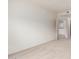 Neutral bedroom showing doorway to the kitchen and carpet flooring at 5450 E Deer Valley Dr # 4199, Phoenix, AZ 85054