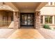 Inviting building entrance with stone columns and decorative glass doors at 5450 E Deer Valley Dr # 4199, Phoenix, AZ 85054
