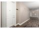 Interior hallway with neutral walls, wood-style floors, and visible unit number at 5450 E Deer Valley Dr # 4199, Phoenix, AZ 85054