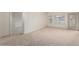 Spacious and bright living area with neutral carpet and access to outdoor space at 5450 E Deer Valley Dr # 4199, Phoenix, AZ 85054