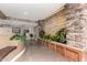Welcoming lobby area with decorative stonework, lush greenery, and the building name 'Toscana' at 5450 E Deer Valley Dr # 4199, Phoenix, AZ 85054