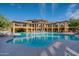 Large community swimming pool with seating and lush landscaping at the Torrana condo complex at 5450 E Deer Valley Dr # 4199, Phoenix, AZ 85054