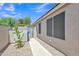 This backyard features stone ground cover, a walkway, block walls, and easy side access at 6027 E Sayan Cir, Mesa, AZ 85215