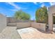 This backyard features stone ground cover, block walls, and a tiled patio area at 6027 E Sayan Cir, Mesa, AZ 85215