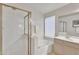 Bathroom features a glass enclosed shower, a soaking tub, and white cabinets at 6027 E Sayan Cir, Mesa, AZ 85215
