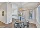 Cozy dining area with a round wooden table set near a large window with natural light at 6027 E Sayan Cir, Mesa, AZ 85215