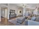 Open-concept living room with neutral furniture, wood floors, and bright, airy feel at 6027 E Sayan Cir, Mesa, AZ 85215