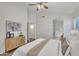 The main bedroom features wood-look floors and a walk-in closet adjacent to the ensuite bathroom at 6027 E Sayan Cir, Mesa, AZ 85215