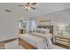 Comfortable main bedroom with neutral tones, decorative artwork and ample natural light at 6027 E Sayan Cir, Mesa, AZ 85215