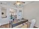 Well-lit home office showcasing a dark wood desk, comfortable chair, and serene decor at 6027 E Sayan Cir, Mesa, AZ 85215