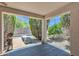 Covered patio featuring textured concrete and mature landscaping at 6027 E Sayan Cir, Mesa, AZ 85215