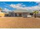Home boasts a spacious backyard and covered patio, perfect for outdoor entertaining at 6038 W Gelding Dr, Glendale, AZ 85306