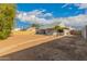 Expansive backyard with room for landscaping and activities, complemented by mature tree at 6038 W Gelding Dr, Glendale, AZ 85306