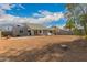 Large backyard is ready for your personal touch with a palm tree and patio at 6038 W Gelding Dr, Glendale, AZ 85306