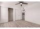 This bedroom boasts ample storage with a sliding door closet and easy access to laundry at 6038 W Gelding Dr, Glendale, AZ 85306