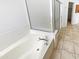 Bathroom showcasing a deep soaking tub with chrome fixtures and a tiled floor at 6617 W Cavedale Dr, Phoenix, AZ 85083