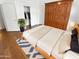 Comfortable bedroom featuring wood-look floors, closet and a light color scheme for a relaxing atmosphere at 6617 W Cavedale Dr, Phoenix, AZ 85083