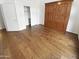 Bedroom boasts wood flooring, closet, stylish wardrobe providing ample storage space at 6617 W Cavedale Dr, Phoenix, AZ 85083