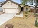 Charming single-story home with desert landscaping, attached two-car garage, and tiled roof at 6617 W Cavedale Dr, Phoenix, AZ 85083
