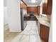Well-lit kitchen features stainless steel appliances, granite countertops, and ample cabinet space at 6617 W Cavedale Dr, Phoenix, AZ 85083