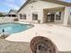 Outdoor patio with a built-in swimming pool, hardscape, and home's stucco exterior and trim at 6617 W Cavedale Dr, Phoenix, AZ 85083
