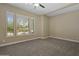 Serene bedroom with neutral tones, plush carpeting, plantation shutters, and ample natural light at 6621 E Oberlin Way, Scottsdale, AZ 85266