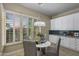 Bright breakfast nook with plantation shutters and a stylish table setting for cheerful morning meals at 6621 E Oberlin Way, Scottsdale, AZ 85266