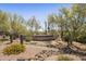 Stone sign for Saguaro Highlands community with desert landscaping at 6621 E Oberlin Way, Scottsdale, AZ 85266