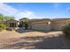 Charming single-story home featuring a three-car garage, beautiful stonework, and a manicured desert landscape at 6621 E Oberlin Way, Scottsdale, AZ 85266