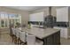 Modern kitchen with granite countertops, stainless steel appliances, and a large island for culinary creativity at 6621 E Oberlin Way, Scottsdale, AZ 85266