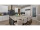 Spacious kitchen with a large island, modern appliances, custom cabinetry, and a decorative backsplash at 6621 E Oberlin Way, Scottsdale, AZ 85266