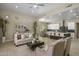 Open-concept living room and kitchen featuring modern decor, recessed lighting, and expansive island seating at 6621 E Oberlin Way, Scottsdale, AZ 85266