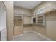 Bright walk-in closet with adjustable shelving and space for shoes and storage at 6621 E Oberlin Way, Scottsdale, AZ 85266