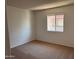 A spacious, carpeted bedroom is flooded with natural light at 700 W University Dr # 203, Tempe, AZ 85281