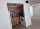 This kitchen features stainless steel appliances and shaker style cabinets at 700 W University Dr # 203, Tempe, AZ 85281