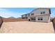 Backyard featuring desert landscaping and a large brick wall for privacy at 7420 S 76Th Ln, Laveen, AZ 85339