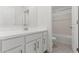 Well-lit bathroom with white vanity, modern fixtures, and a bathtub at 7420 S 76Th Ln, Laveen, AZ 85339