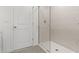 Bathroom with a glass enclosed shower and marble surround at 7420 S 76Th Ln, Laveen, AZ 85339