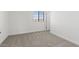 Cozy bedroom with neutral carpet, bright window, and closet for storage at 7420 S 76Th Ln, Laveen, AZ 85339