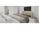 Relaxing bedroom featuring neutral decor, a TV, and soft, plush bedding at 7420 S 76Th Ln, Laveen, AZ 85339