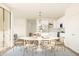Elegant dining room with seating for six and access to kitchen, perfect for entertaining guests at 7420 S 76Th Ln, Laveen, AZ 85339