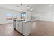 Stylish kitchen island with stainless steel dishwasher and sink, complemented by an open floor plan at 7420 S 76Th Ln, Laveen, AZ 85339