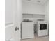Bright laundry room featuring side-by-side washer and dryer at 7420 S 76Th Ln, Laveen, AZ 85339