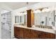 Bathroom vanity featuring dual sinks, granite counters and lots of storage space at 8405 E San Pedro Dr, Scottsdale, AZ 85258