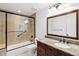 Bathroom with granite counters, a dark vanity, and a bathtub shower combination at 8405 E San Pedro Dr, Scottsdale, AZ 85258