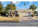 Attractive home featuring a two-car garage, neatly landscaped front yard, and charming brick accents at 8405 E San Pedro Dr, Scottsdale, AZ 85258